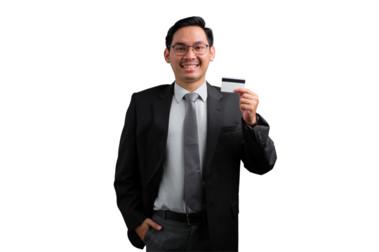 Confident young Asian businessman holding credit card and smiling isolated on transparent background