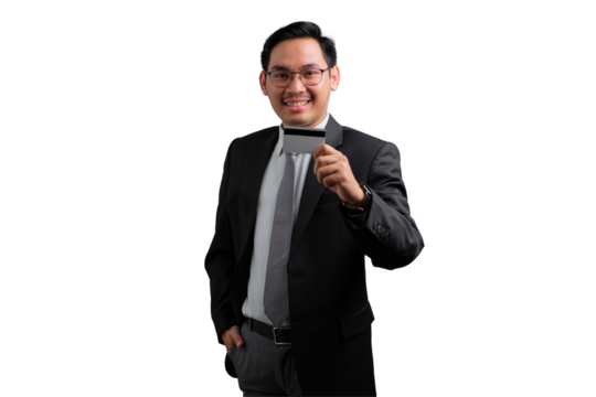 Confident young Asian businessman holding credit card and smiling isolated on transparent background