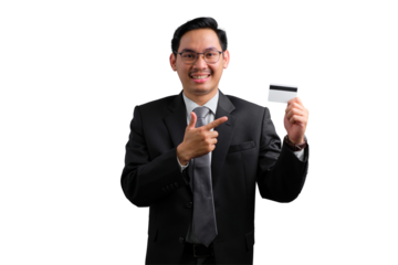 Happy young Asian businessman pointing at credit card and smiling isolated on transparent background