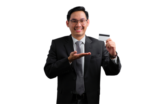 Confident young Asian businessman holding credit card and smiling isolated on transparent background