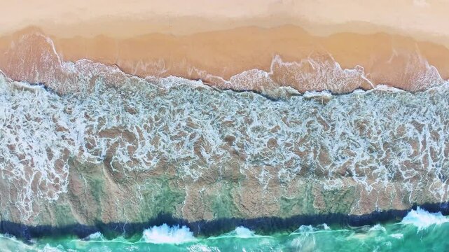 Beautiful sea summer landscape, Waves sea water surface High quality video ProRes HQ, Bird's eye view waves background, Drone top view waves crashing on sand beach,Nature ocean sea beach background