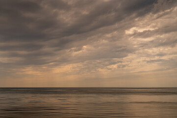 Ocean with sky in horizon. Calm sea in evening. Seascape at sunset.
