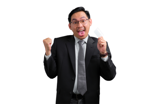 Happy young Asian businessman celebrating success with credit card and fist pump isolated on transparent background