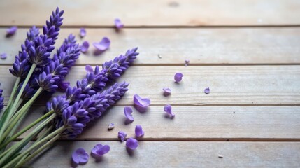 Obraz na płótnie Canvas A fragrant bouquet of lavender blossoms rests on a rustic wooden surface, scattered petals adding to the serene and calming scene.