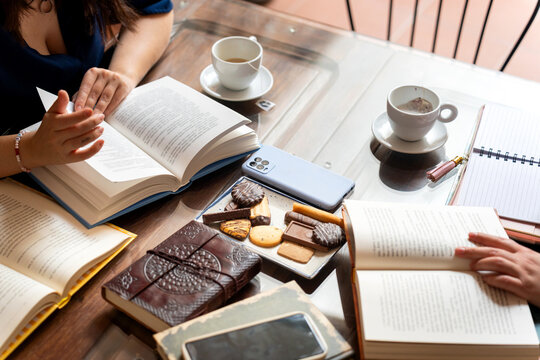 Writers reading and sharing ideas at book club meeting
