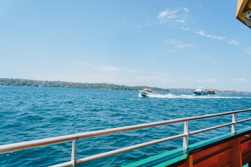 Boat and ferry in the Sydney Harbour on the Manly Ferry in Sydney, NSW, Australia