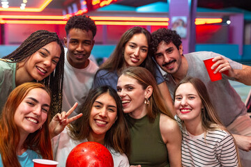Group of friends enjoying bowling night out together