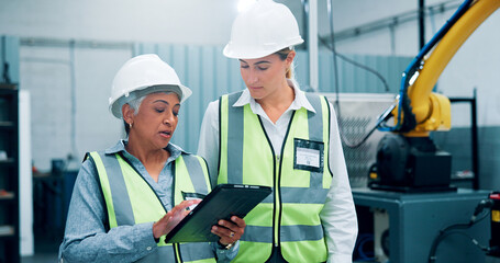 Women, robotics and meeting in lab, tablet and conversation with software update. Employees,...