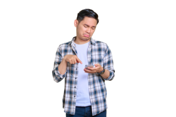 Disappointed young Asian man in plaid shirt using mobile phone, reacting to bad news isolated on transparent background