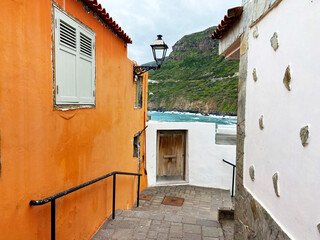 Beautiful street with traditional canarian houses in San Juan de la Rambla,Tenerife,Canary islands,Spain.Travel concept.Selective focus.