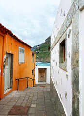 Fototapeta premium Beautiful street with traditional canarian houses in San Juan de la Rambla,Tenerife,Canary islands,Spain.Travel concept.Selective focus.