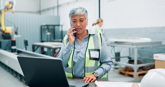 Engineer, laptop and phone call in robotics factory for manufacturing schedule, planning and project management. Mature woman, operator and tech in industrial plant for automation update with contact