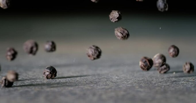 Peppercorns or black pepper spice. Super Macro Close Up. Shot on super slow motion camera 1000 fps.
