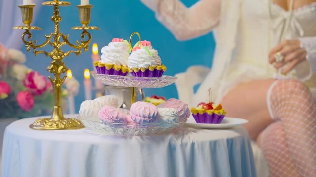 blurred silhouette sexy woman queen sitting at dinner table eating dessert cakes pies marshmallows sweet confectionery. Fantasy Girl princess having breakfast Victorian style room, vintage dress 4k