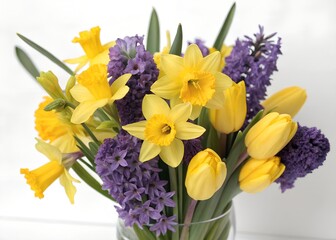 Colorful spring bouquet featuring vibrant yellow daffodils, purple hyacinths, and soft yellow tulips arranged against a transparent background perfect for seasonal decoration