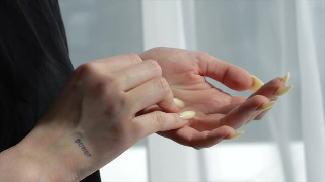 Girl with tattoos scratches her arm with a large finger.
Female arm suffers from severe itching of the skin.
Skin problems.
Dermatologist help for skin inflammation