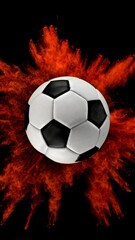 Fototapeta premium Soccer ball with coloured powder explosion.