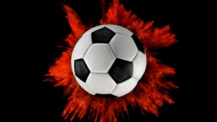 Soccer ball with coloured powder explosion.