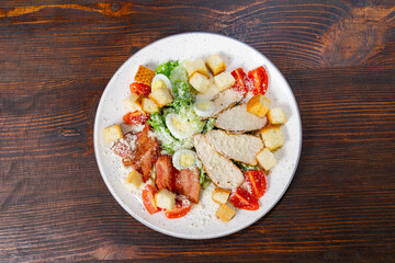 Delicious salad with grilled chicken and fresh vegetables served