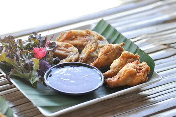 chicken wings or deep fried chicken , fried chicken and sauce