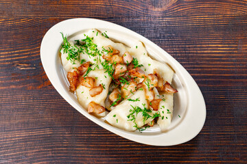 Delicious stuffed dumplings with crispy bacon and herbs