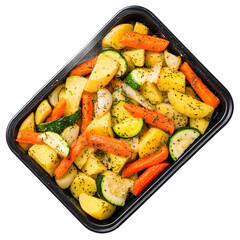 Delicious roasted vegetables including potatoes, carrots, zucchini, and onions are sprinkled with herbs on a black baking pan ready to be served and enjoyed.
