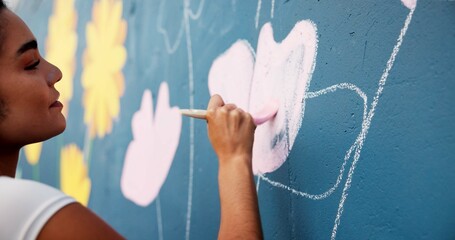 Woman, hand or painting on wall art for creativity, mural or community service at building. Artist,...