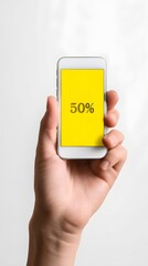 A hand holding a phone with a yellow screen that says 50% on it. Concept of urgency or excitement
