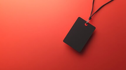 Fototapeta premium Blank black tag against red background