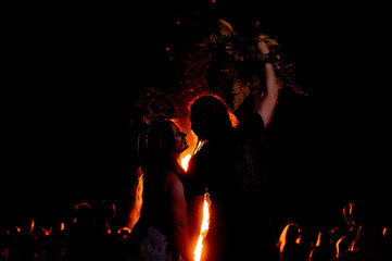 People dance in the firelight on Ivan Kupala