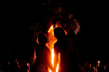 People dance in the firelight on Ivan Kupala