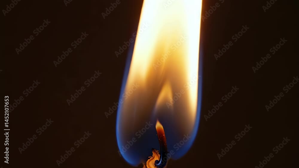 Poster this mesmerizing image captures the smooth movement of a flame against a dark background, showcasing
