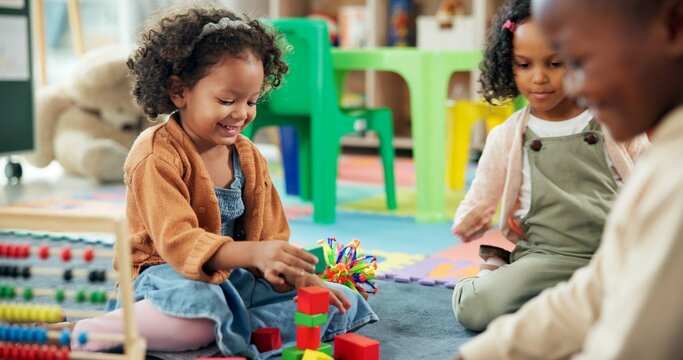 Education, student and playing with building blocks in classroom for creative development, fun activity or learning. Happy, kids or stack toys at kindergarten for coordination and sensory imagination