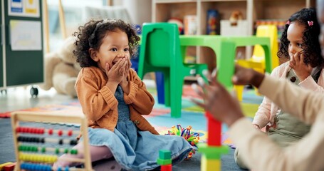 Surprise, child and play with blocks in classroom for learning, problem solving and creative activity. Excited, kids and toys for education game, puzzle solution and motor growth in kindergarden