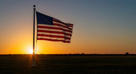 Flag Waving at Sunset Over Field with Golden Light