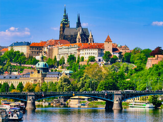 Scenic View of Prague Castle with Boats on Vltava River. Captivating Cityscape Featuring Historic Architecture and Vibrant Waterways for Travel and Tourism. 