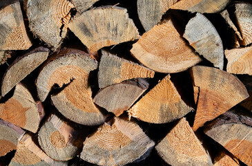 Fototapeta premium Background of chopped firewood closeup