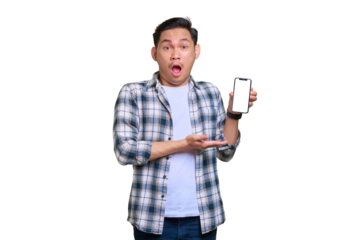 Shocked young Asian man in plaid shirt showing mobile phone blank screen recommending app isolated on transparent background