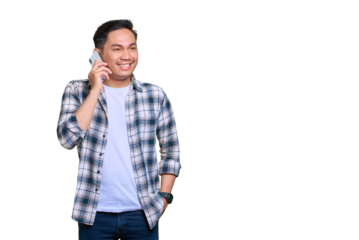 Smiling young Asian man in plaid shirt talking on mobile phone, looking aside at copy space isolated on transparent background