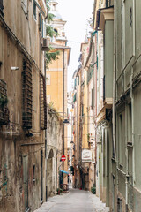 Genoa, Italy - September 22, 2024: Narrow alleys in the historic center of Genoa, showcasing the charm of the old town with its winding streets and traditional architecture