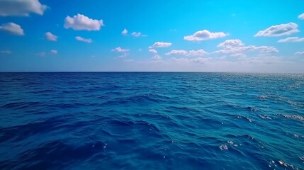 Obraz premium Serenity of Open Sea: Azure Waters and Billowing Clouds Under a Vast Sky