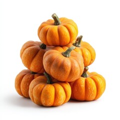 A Stack of Small Orange Pumpkins Isolated on White Background Perfect for Autumn Thanksgiving or Halloween Designs