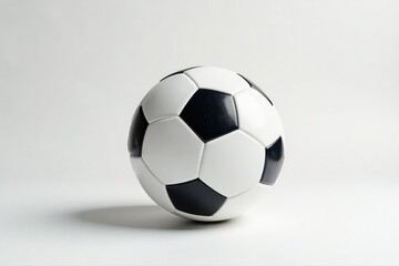 Studio shot of pristine white football against pure white backdrop , still life, isolated