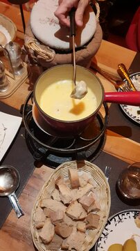 People sharing a swiss fondue