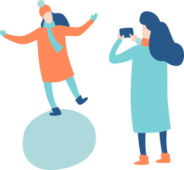 Woman with smartphone taking picture of her female friend balancing on a snowball, both wearing winter clothes, simple flat vector illustration