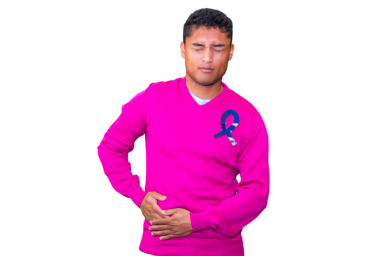 Young man suffering from colorectal cancer pain, holding his belly.