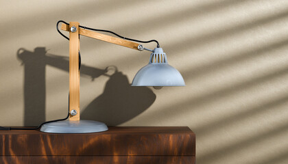 Office lamp standing on a wooden shawl against the wall. Retro or vintage style desk lamp, classic wooden arm with metal base and grey colored canopy.