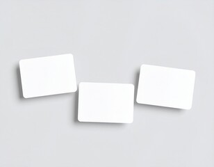 Minimalist business card mockup on gray background, three blank cards with rounded corners, top view template for branding, identity, print design presentation