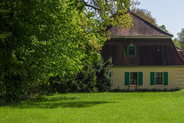 Obraz premium House in the forest. Atmospheric hut in the summer forest