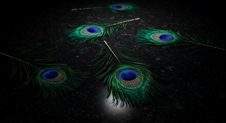 Five Peacock Feathers Laying on a Dark Textured Surface Displaying Iridescent Greens Blues and Browns in Dramatic Lighting